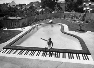 Liberace grand piano-shaped pool in his California backyard in 1954